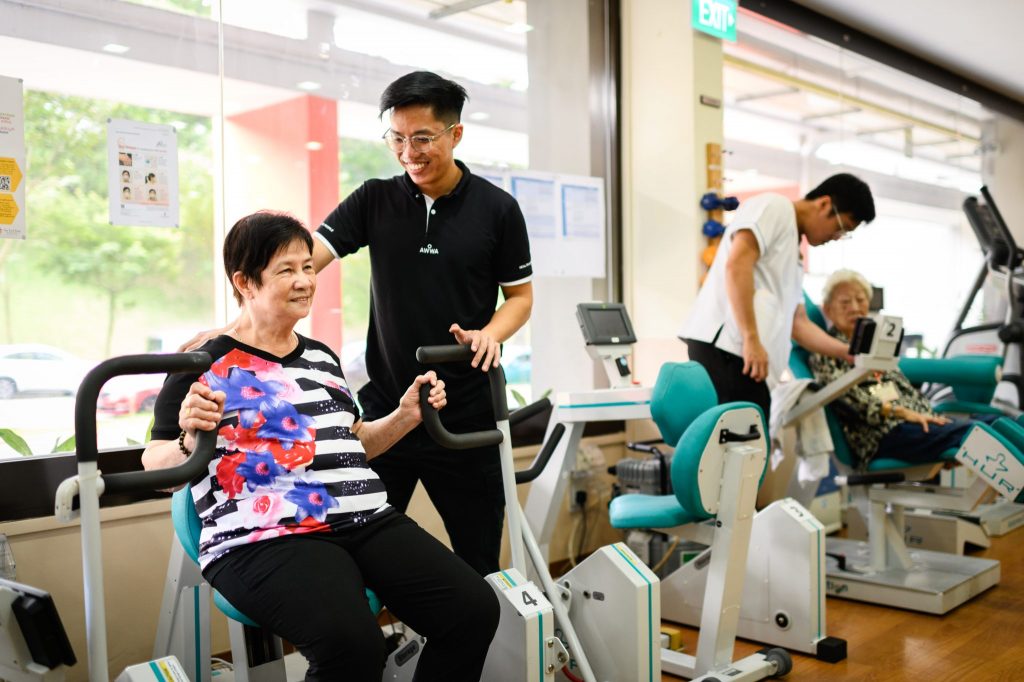 AWWA staff member standing with an elderly participant
