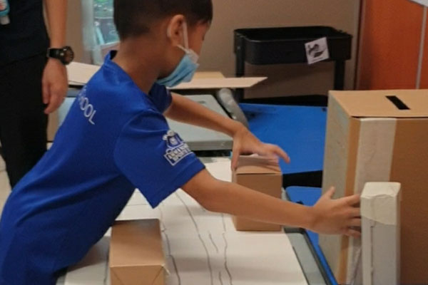 Boy opening up a box