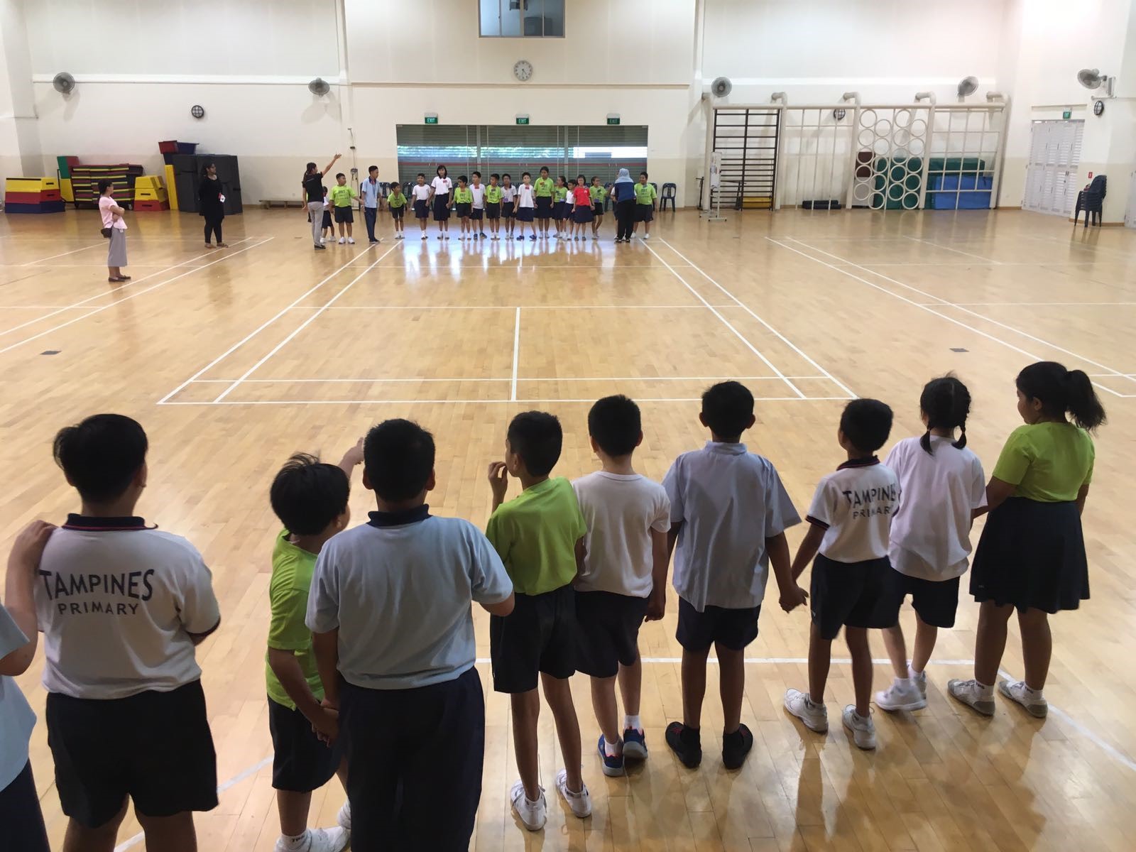 Students playing in an indoor court