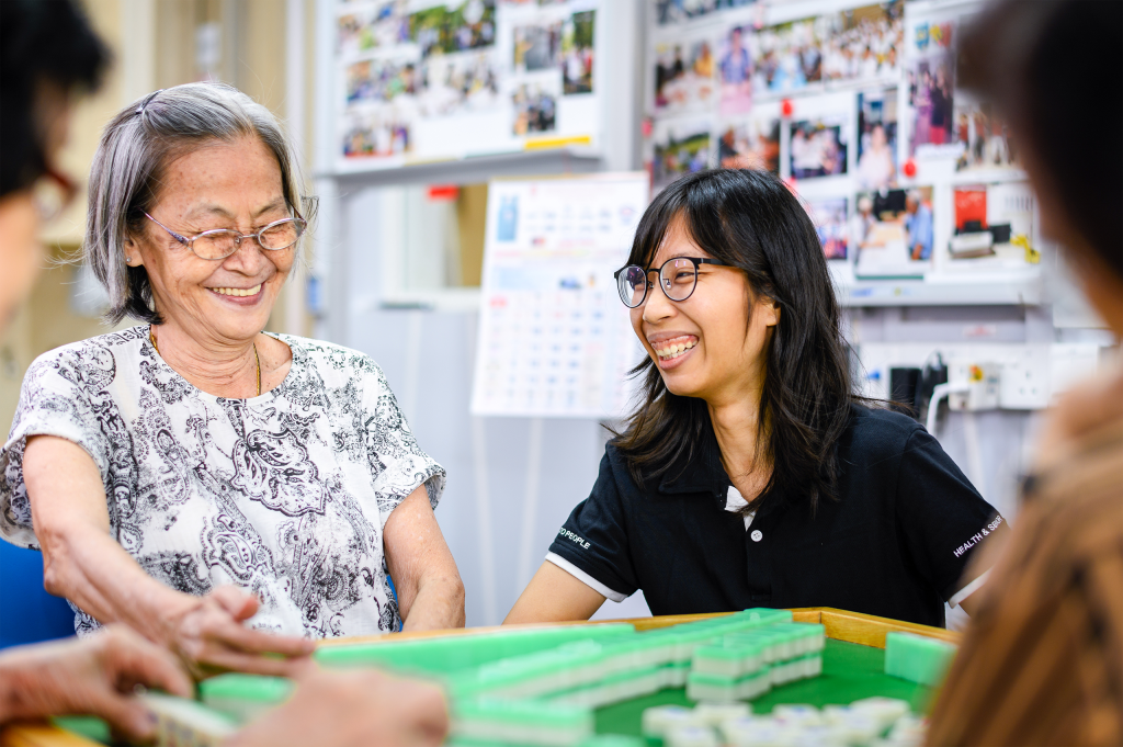 AWWA staff member standing with an elderly participant