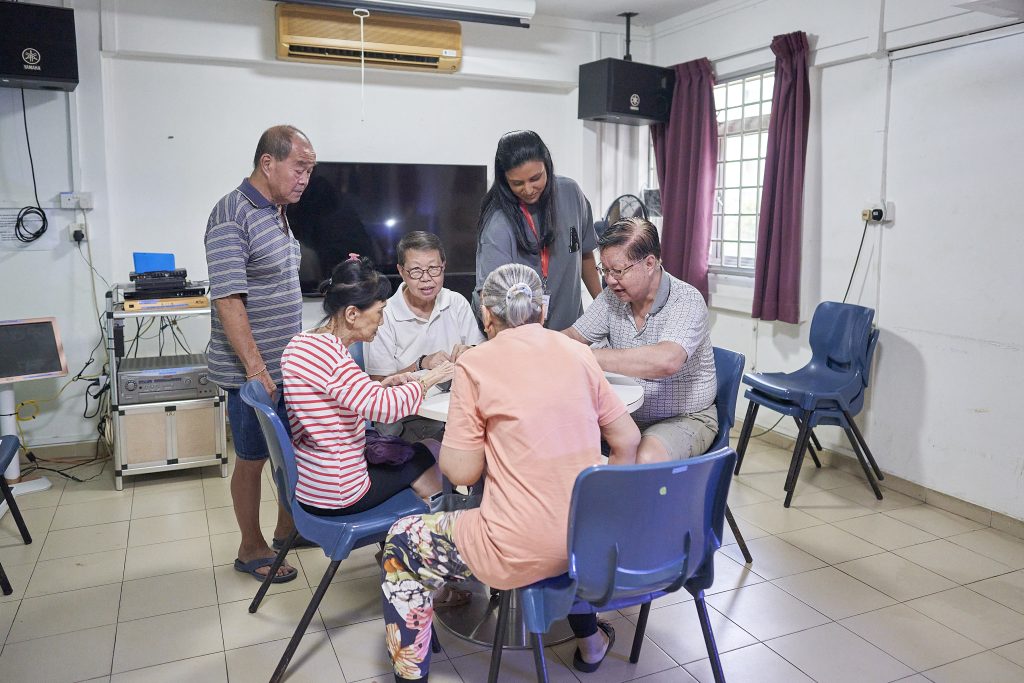 AWWA staff member standing with an elderly participant