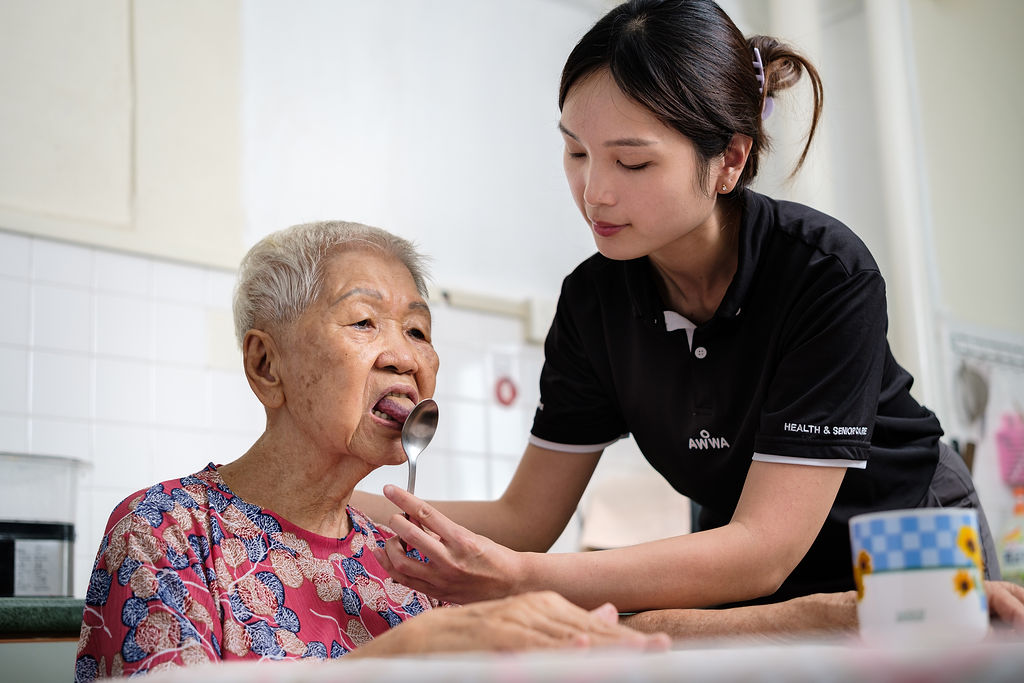 AWWA staff member standing with an elderly participant