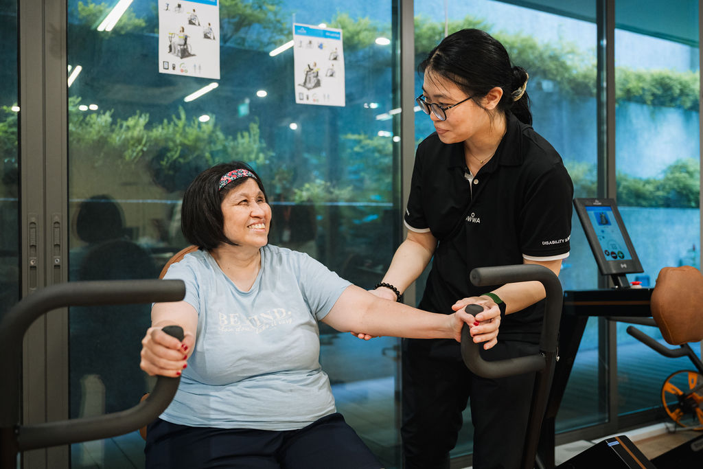 AWWA staff member standing with an elderly participant