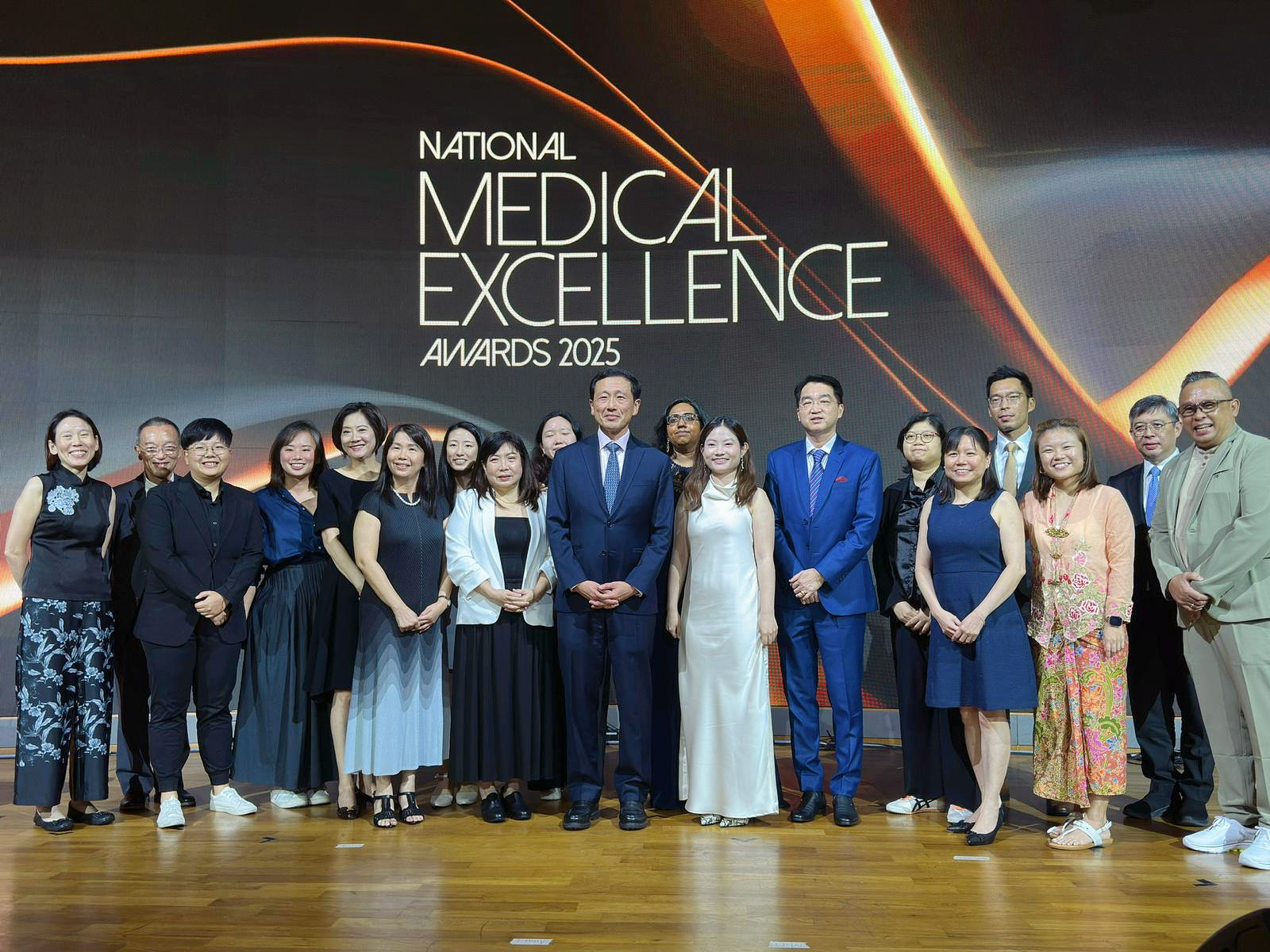 Group of individuals on a stage at the national medical excellence awards 2025