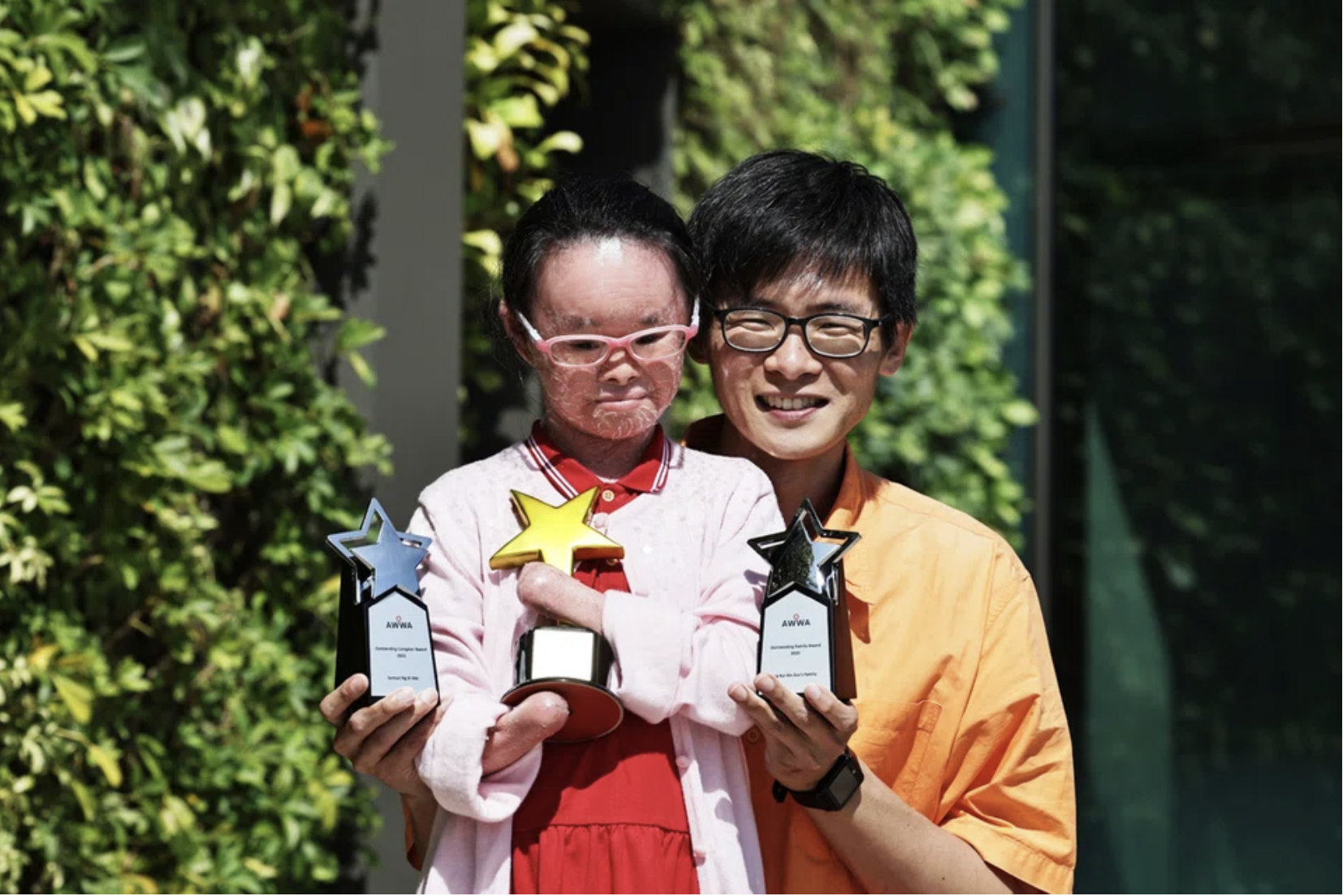 Zoe ng and her father samuel ng at community integration awards 2025